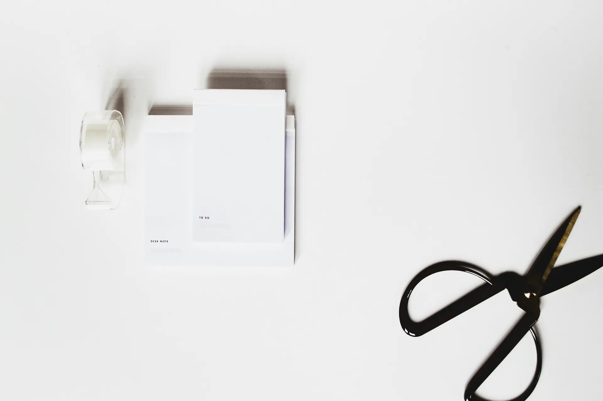 A minimalist neutral workspace with premium stationery details.
